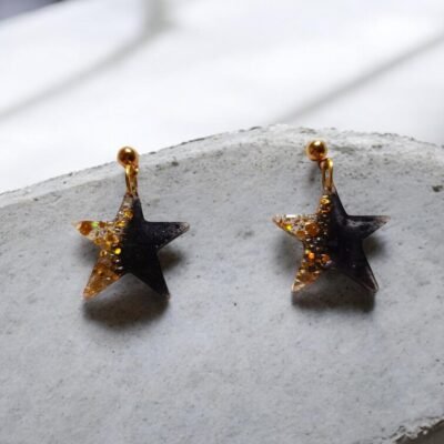Boucles d'oreilles étoiles noir et or
